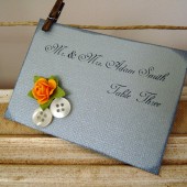 Place cards with button and floral details