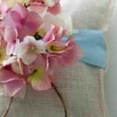 White Burlap Ring Pillow With Ribbon and Magnolia