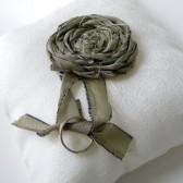 Off-white linen wedding ring pillow with sage rosette