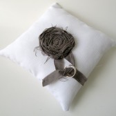 White cotton wedding ring pillow with dark grey rosette