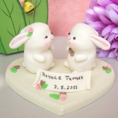 Bunny wedding cake topper with decorated wood stand