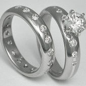 Titanium wedding set with Platinum Diamonds and a large white sappire
