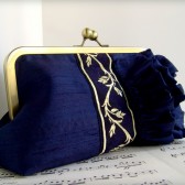 Navy blue silk clutch with ruffles