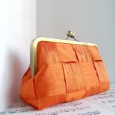 Tango tangerine woven clutch