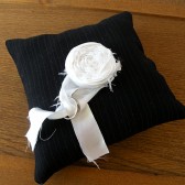 Black pinstripe weding ring pillow with white satin rosette