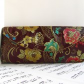 Brown brocade clutch