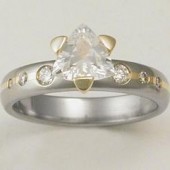Titanium engagement ring with 18k inlays and white sapphire