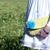 yellow clutch purse with teal chiffon flower