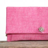 pink clutch purse with vintage brooch