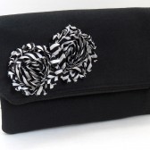 Black fold over clutch with striped fabric flower