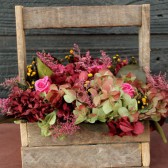 green and burgundy hydrangea with roses centerpiece