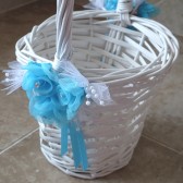 white flower girl basket with turquoise roses