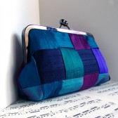 Peacock silk woven clutch