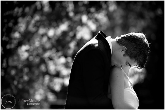 bride groom kiss on shoulder