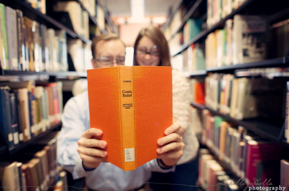 couple with glasses comic relief book holding comic relief book
