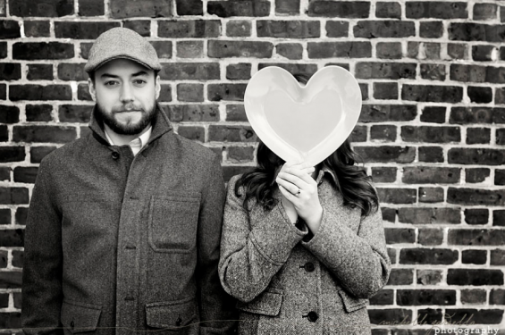 couple holding heart engagement session with heart
