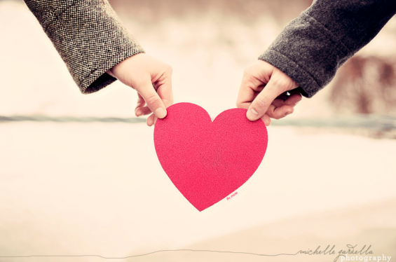 engagement session with red heart engagement session hands holding red heart