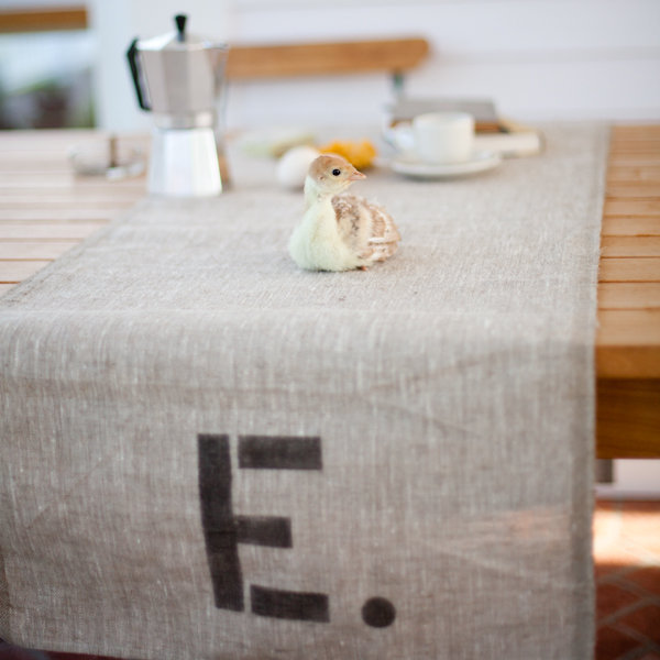 We love reusable personalized wedding decor in fact this table runner 