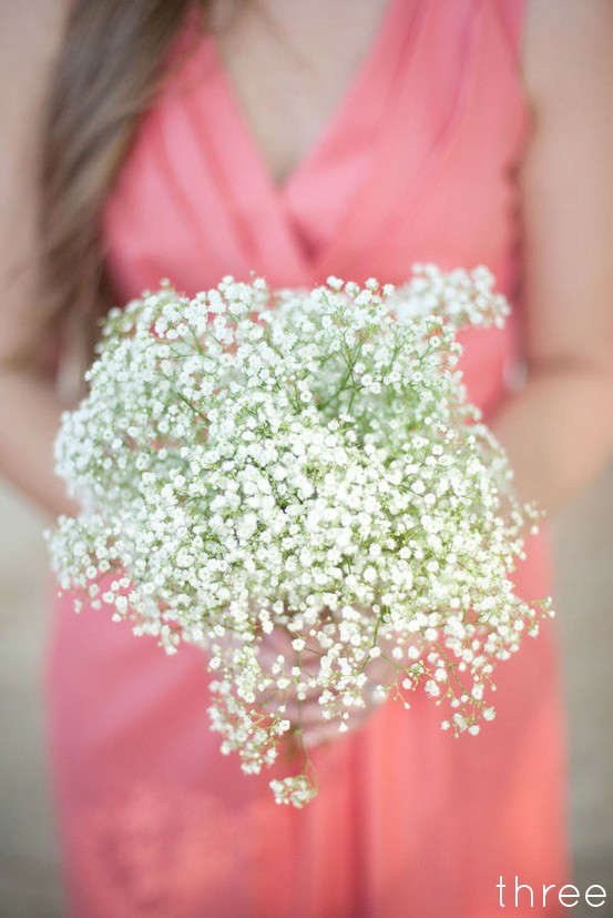 For a chic and inexpensive aisle decor idea try grouping baby's breath 