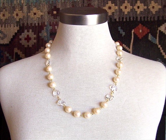It is made with large vintage pearls vintage chandelier crystals and a 