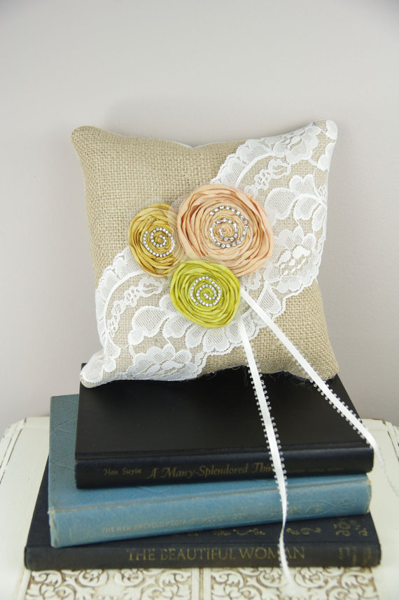 The flowers add a whimsical touch burlap wedding ring pillow