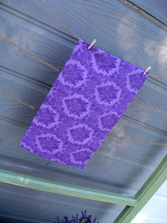 The purple dinner napkins we mentioned earlier are also handmade by Just 