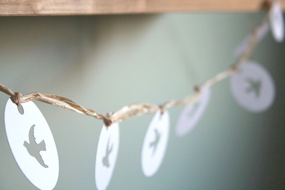Add birdcages to your reception tables to tie in the bird wedding 