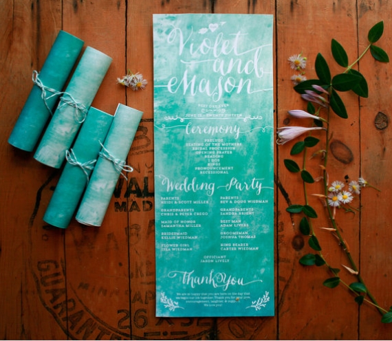 rolled up wedding program with blue watercolor design