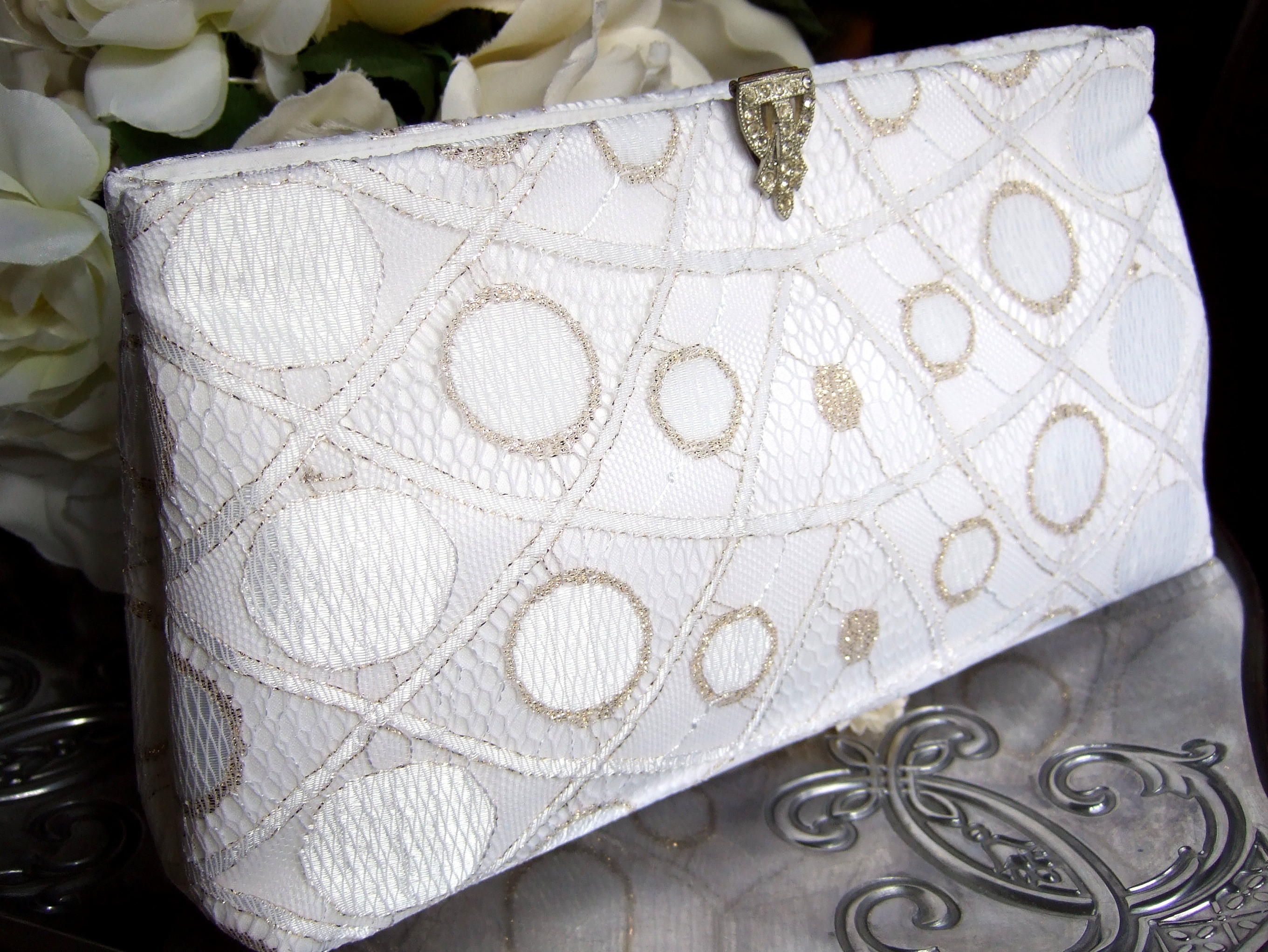 white clutch with gold