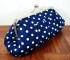 navy and white polka dot clutch bag