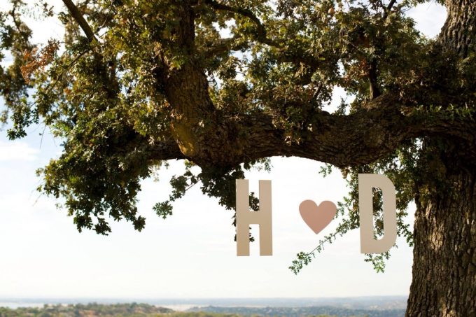 hanging initials decor | via Heart and Arrow Wedding Ideas: https://emmalinebride.com/themes/heart-and-arrow-wedding-ideas