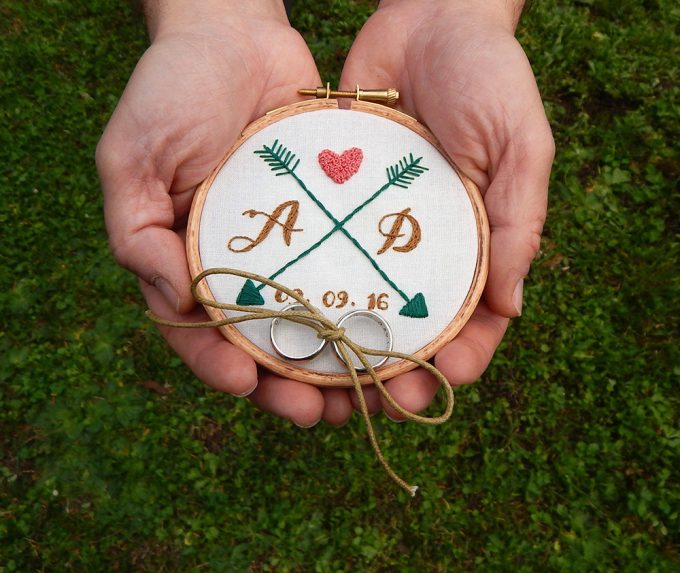 hoop art ring bearer pillow alternative | via Heart and Arrow Wedding Ideas: https://emmalinebride.com/themes/heart-and-arrow-wedding-ideas