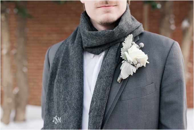 groom with custom scarf and white boutineer in this Sedgefield Country Club wedding| Greensboro, North Carolina winter wedding photographed by Michelle Robinson Photography - https://emmalinebride.com/real-weddings/sedgefield-country-club-wedding/