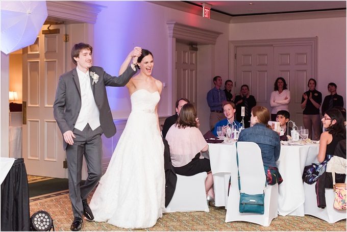 bride and groom enter reception at this Sedgefield Country Club wedding| Greensboro, North Carolina winter wedding photographed by Michelle Robinson Photography - https://emmalinebride.com/real-weddings/sedgefield-country-club-wedding/