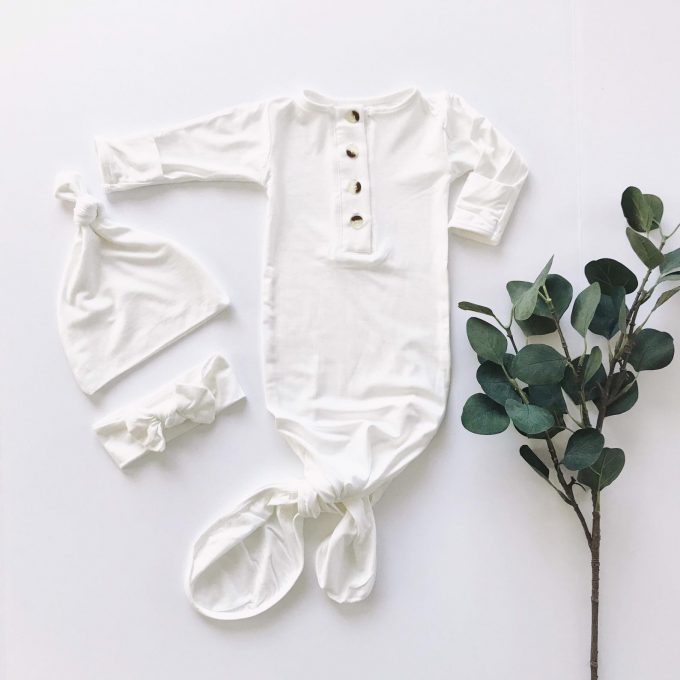 white knotted baby gown