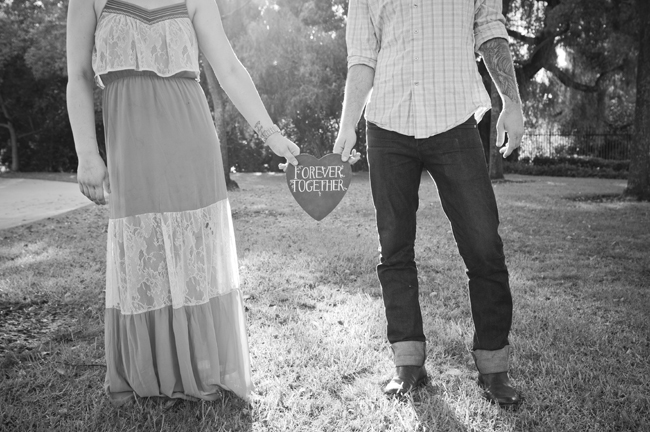 black and white photo of chalkboard engagement sign
