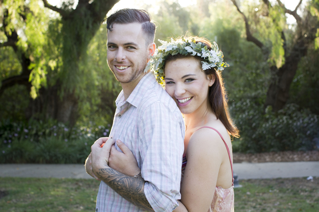 she holds him and they smile at their Santa Fe Springs engagement session