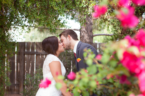 rustic chic arizona wedding bride and groom kissing at Shenandoah Mill