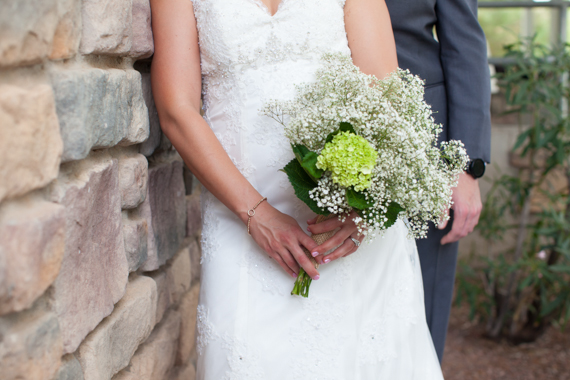 rustic chic arizona wedding with bride holding flowers