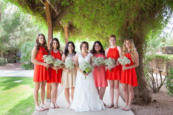rustic chic arizona wedding at Shenandoah Mill with bride and bridesmaids in red dresses