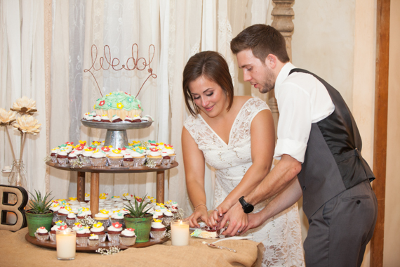 rustic chic DIY wedding at Shenandoah Mill cupcake table, bride and groom cutting
