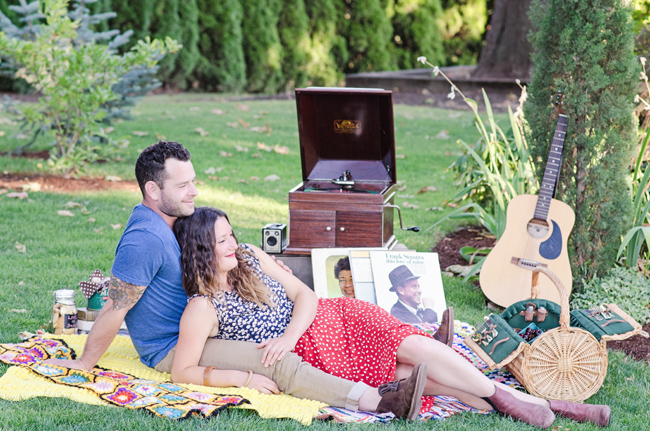 couple on picnic blanket for styled engagement session| Photo: White Ivory Photography | via https://emmalinebride.com/real-weddings/hipster-engagement-session-what-does-one-look-like/