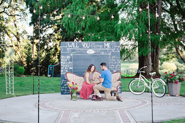 couple proposal by chalkboard sign in styled shoot| Photo: White Ivory Photography | via https://emmalinebride.com/real-weddings/hipster-engagement-session-what-does-one-look-like/