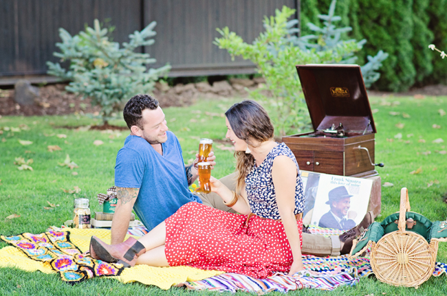 hipster engagement session on picnic blanket| Photo: White Ivory Photography | via https://emmalinebride.com/real-weddings/hipster-engagement-session-what-does-one-look-like/