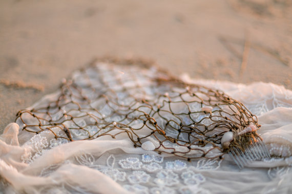 beach wedding veil on sand