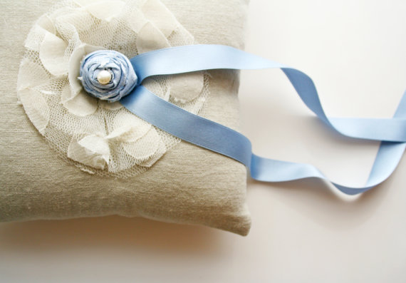 blue rosette ring pillow via 8 Chic Linen Ring Pillows