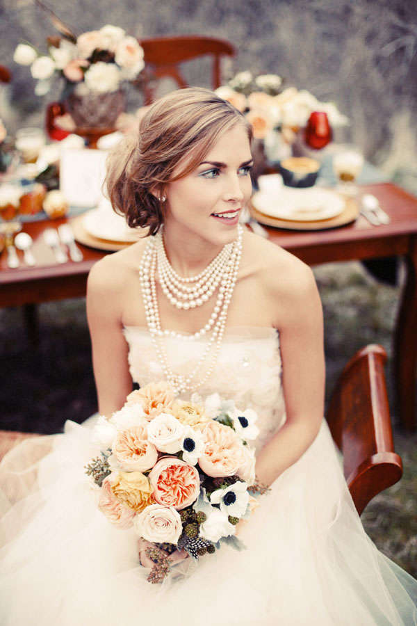 bride wearing layered pearl necklace