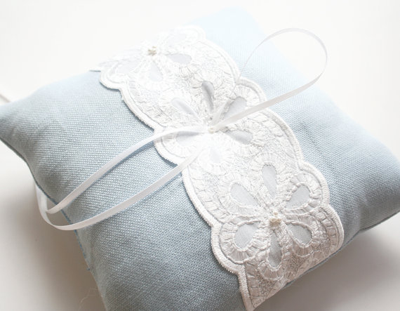light blue lace ring pillow via 8 Chic Linen Ring Pillows