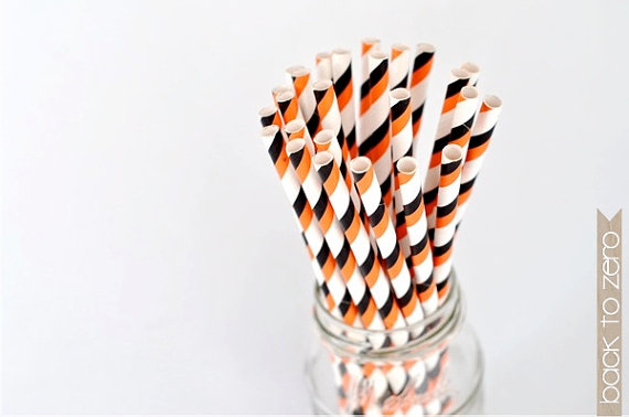 orange and black striped straws via 30 Amazing Halloween Wedding Ideas from EmmalineBride.com