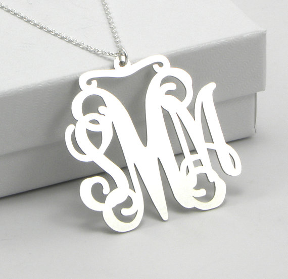 wedding trend: great idea! put on the monogram ring after the ceremony to officially 'announce' your new initials (via Monogram Necklace for Weddings from Emmaline Bride)